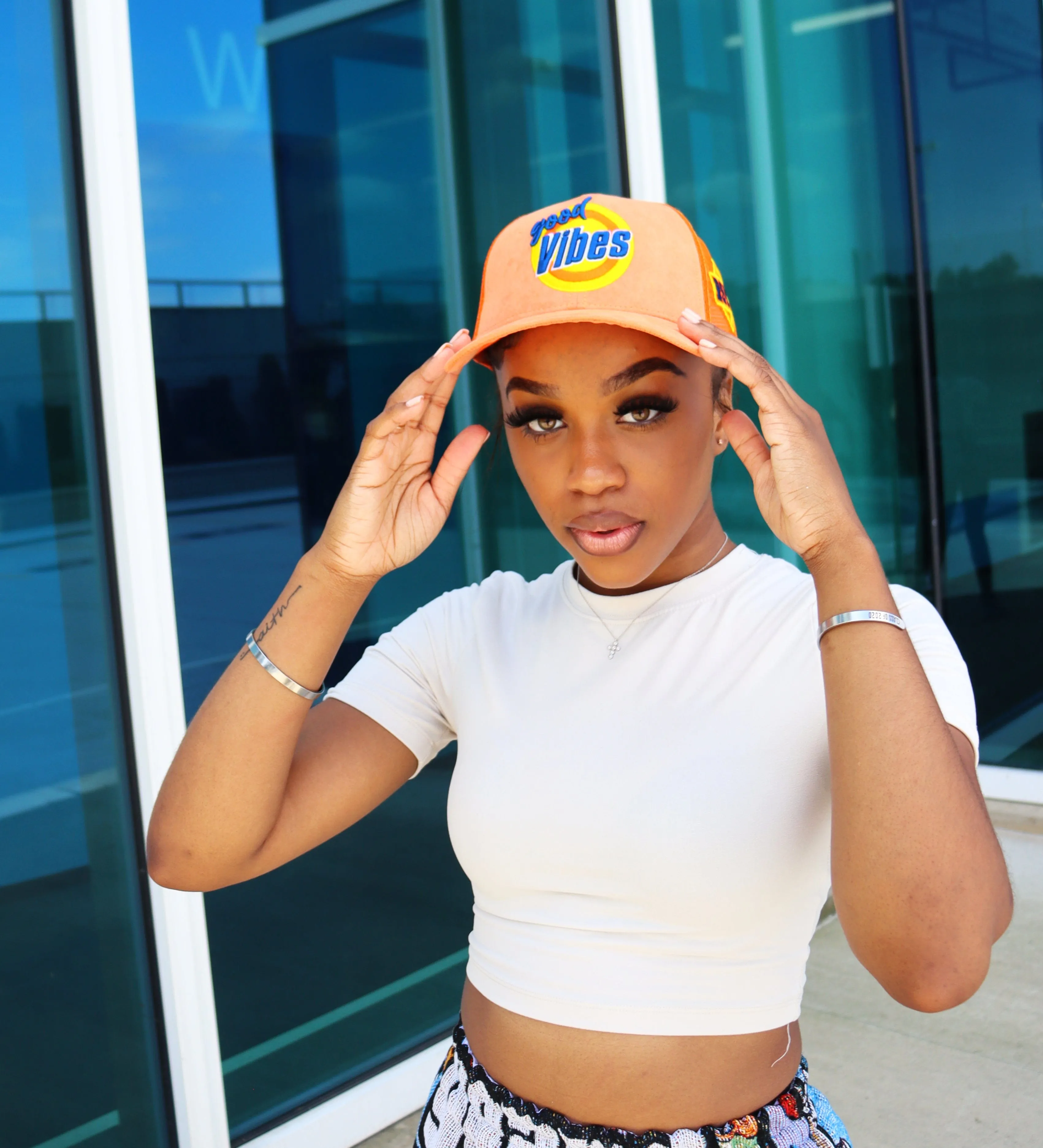 RISKY REWARDS “GOOD VIBES” ORANGE TRUCKER HAT