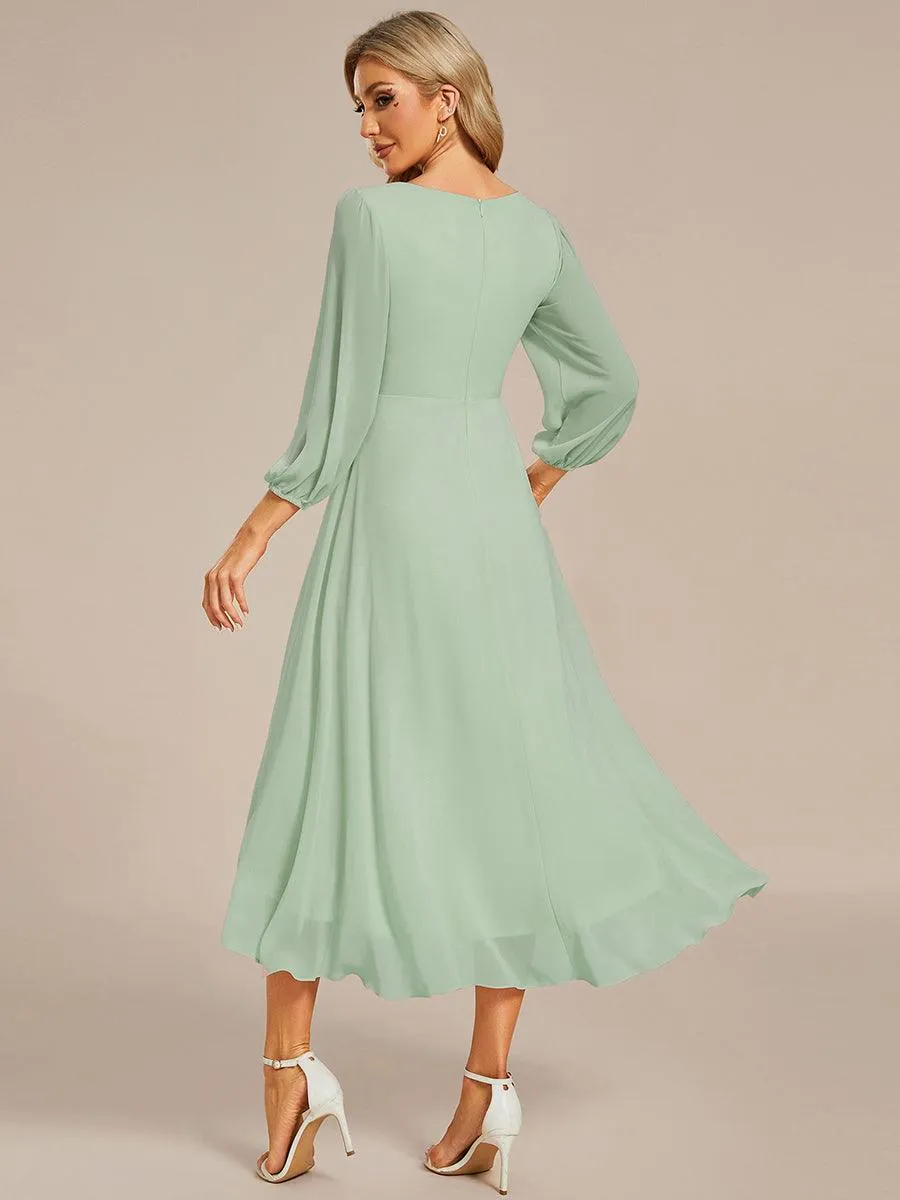 Robe invité de mariage mi-longue manches longues ourlet asymétrique