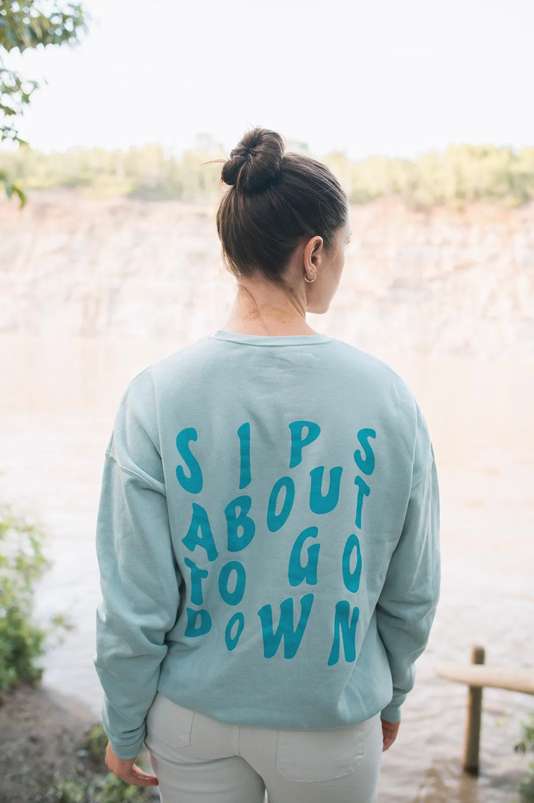 The SIPS ABOUT TO GO DOWN Sweatshirt